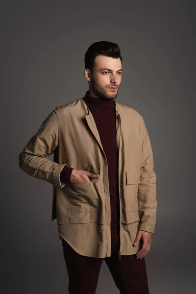 Bearded man posing in autumn jacket isolated on grey — Fotografia de Stock