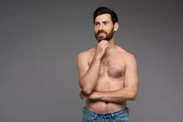 Shirtless and bearded man with hair on chest smiling isolated on grey — Stockfoto