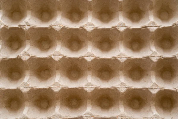 Top view of empty and recyclable cardboard egg container — Stock Photo