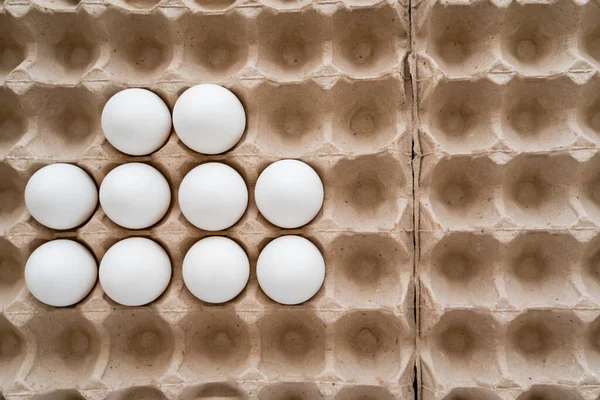 Top view of organic chicken eggs in carton tray — Stock Photo