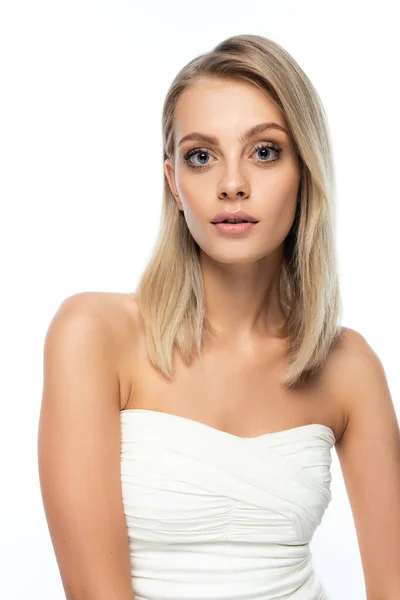 Portrait of woman with natural makeup and blue eyes looking at camera isolated on white — Stock Photo