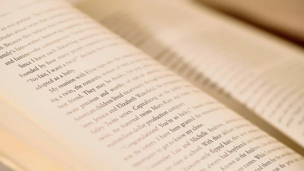 Close up view of open book with blurred pages at background — Stock Photo