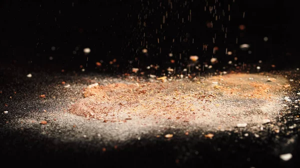 Close up view of crashed beige face powder on black background — Stock Photo