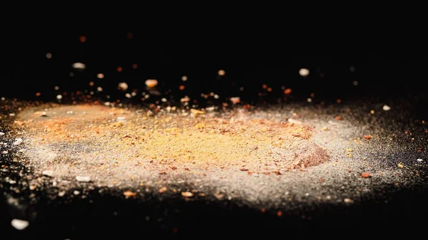 Close up view of beige face powder on black surface — Stock Photo