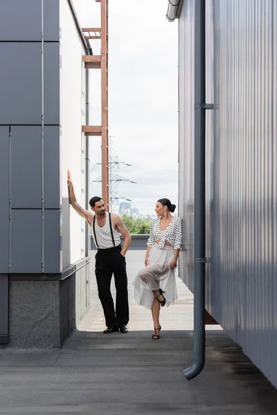 Professional dancers standing on rooftop of building at daytime — Stock Photo