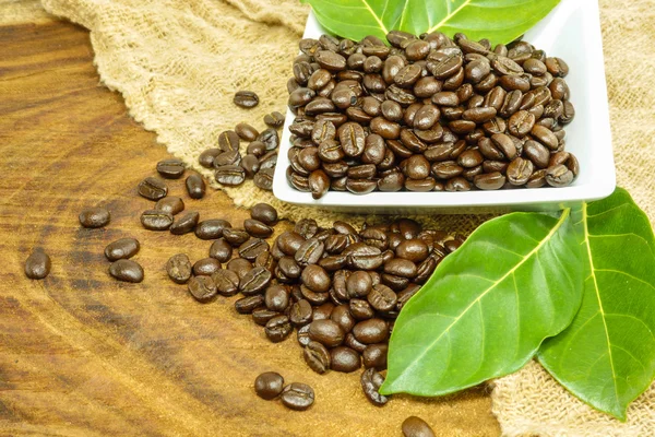 Coffee beans on the wooden background. — Stock Photo, Image