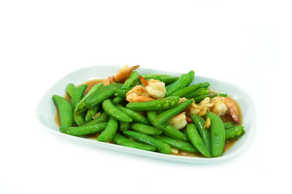 Fried shrimp with fresh peas. — Stock Photo, Image
