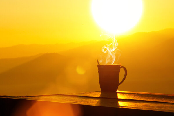 Silhouettes on sunrise morning coffee.