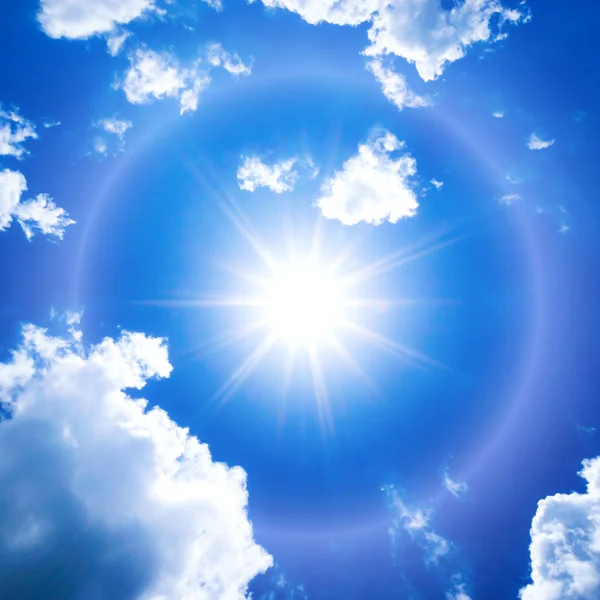 Blue sky with clouds and sun. — Stock Photo, Image