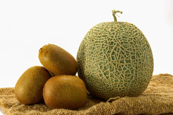 Netted melon and kiwi on white background — Stock Photo, Image