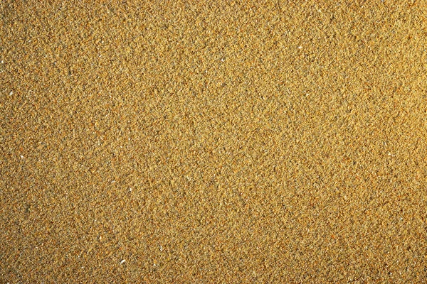 Primo piano di spiaggia mare sabbia texture e sfondo — Foto Stock
