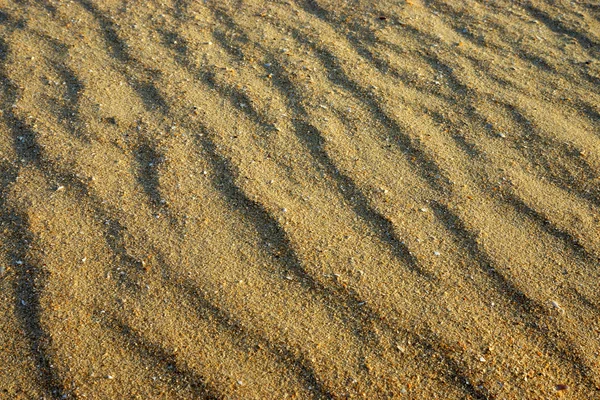 Close up van zee strand zand textuur en achtergrond — Stockfoto