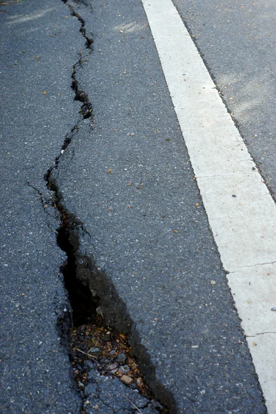 A road is being destroyed by a landslide — Stock Photo, Image