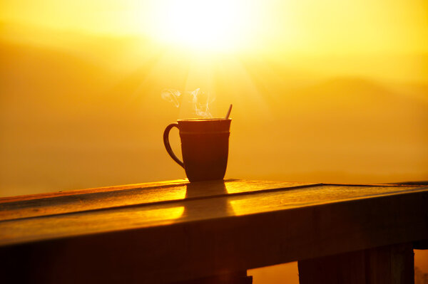 Silhouettes on sunrise morning coffee.