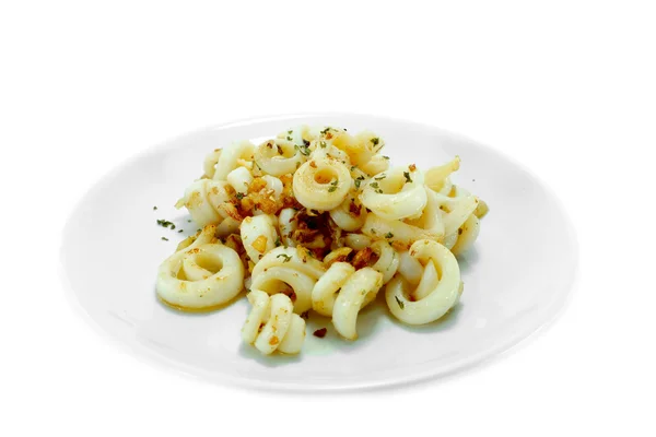 Fried squid with garlic and rosemary mixture. — Stock Photo, Image