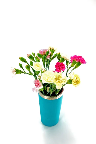 Smaller carnations on a white background for mother's day. — Stock Photo, Image