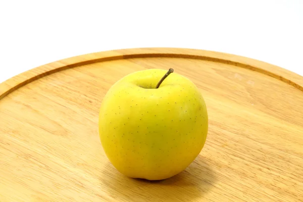 Manzana amarilla sobre madera — Foto de Stock