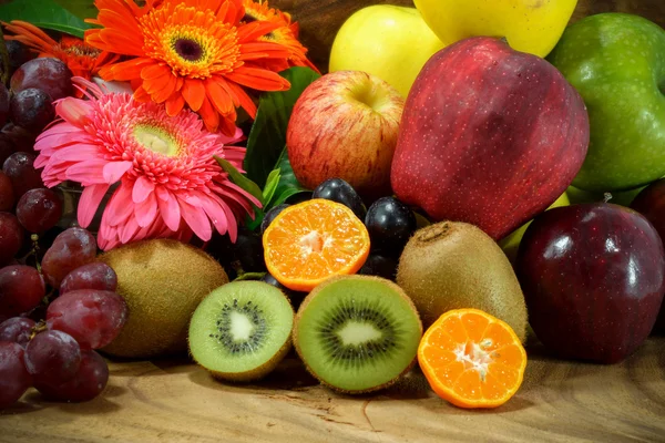 Assortment of exotic fruits on wood background. — Stock Photo, Image