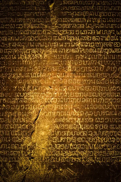 Ancient Thai writing chiseled on stone — Stock Photo, Image