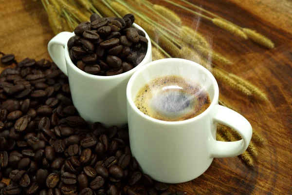 Coffee and roasted coffee beans on wooden — Stock Photo, Image