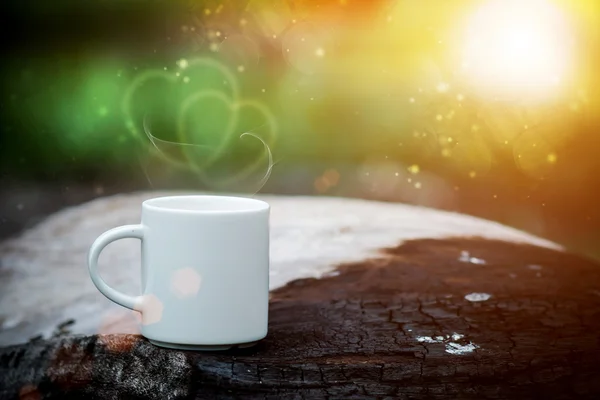 Morning coffee with white cup on the wood charcoal. — Stock Photo, Image