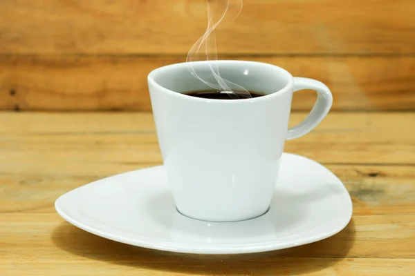 Coffee cup and saucer on a wood. — Stock Photo, Image