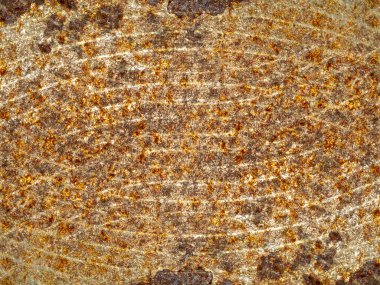 Rust patterns on the surface of the deteriorated industrial metal.