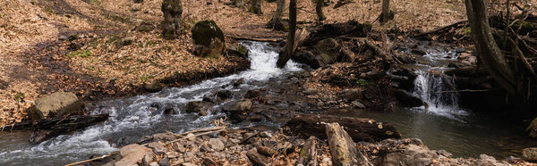 Mountain river and stones in forest in autumn, banner 