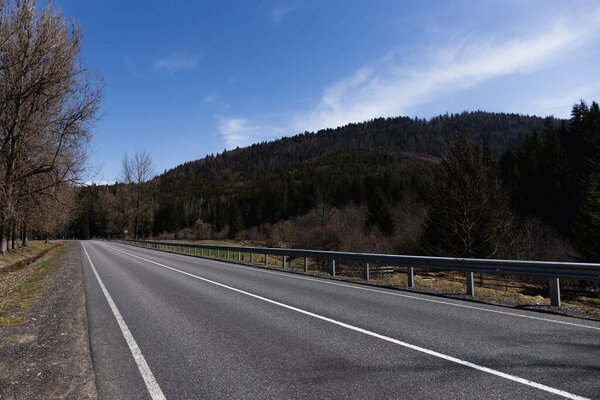 Road and mountain with sky at background 