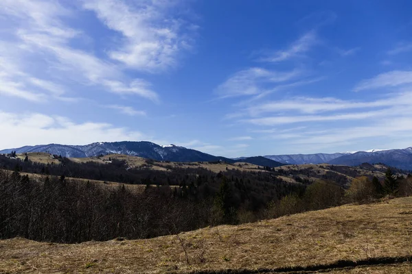 Scenic view of mountains and blue sky at background 
