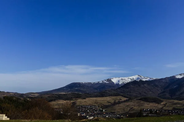 Landscape with mountains and blue sky at background  