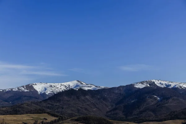 Mountains with snow and blue sky at daylight 