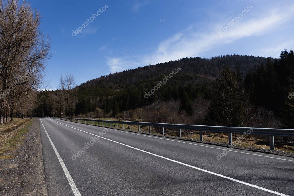 Road and mountain with sky at background