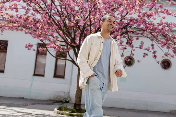 Positive African American Man Shirt Jacket Walking Hand Pocket Cherry — Stock Photo, Image