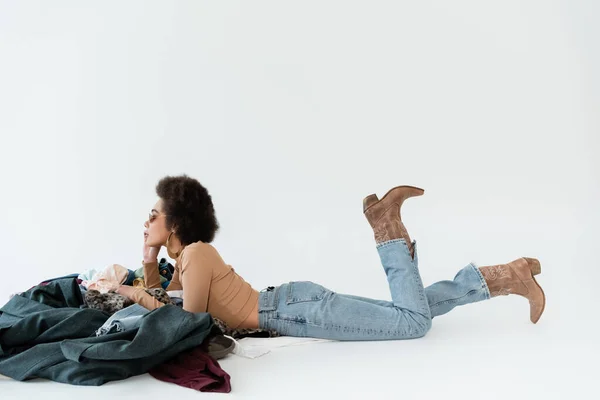 Side View African American Woman Jeans Cowboy Boots Lying Pile —  Fotos de Stock