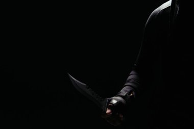 Cropped view of african american bandit holding knife isolated on black  clipart