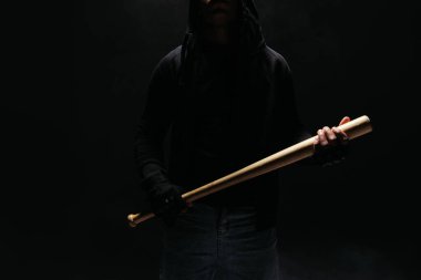 Cropped view of african american vandal holding baseball bat isolated on black  clipart