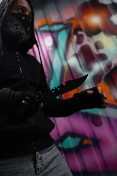 Low Angle View African American Bandit Mask Holding Knife Graffiti — Stockfoto