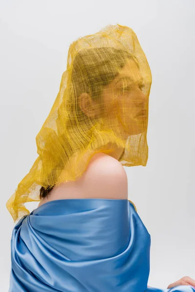 Young Ukrainian Woman Woman Yellow Drapery Covering Face Looking Away — 스톡 사진