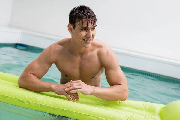 Cheerful Wet Man Looking Away Swimming Mattress Pool —  Fotos de Stock