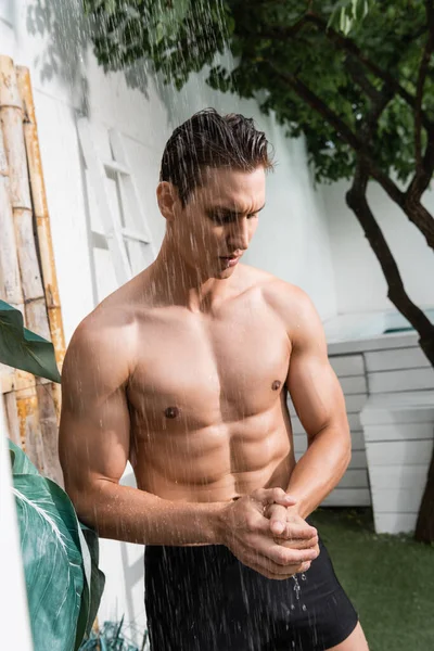 Sportive Man Swimming Trunks Taking Shower Outdoors — Φωτογραφία Αρχείου