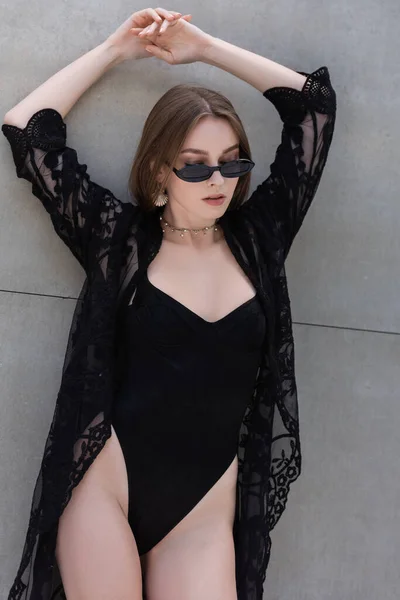 Stylish Woman Black Swimwear Guipure Robe Standing Wall — Stockfoto