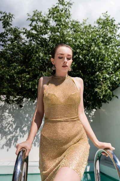 Young Stylish Woman Summer Dress Posing Pool Ladder Green Leaves — стоковое фото
