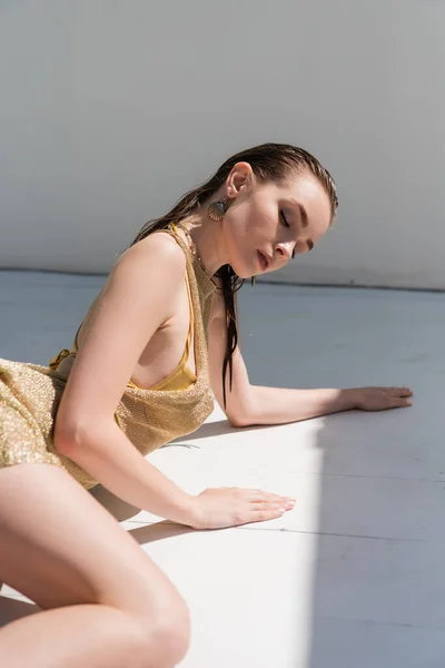 Young Woman Golden Summer Dress Lying White Surface — Photo