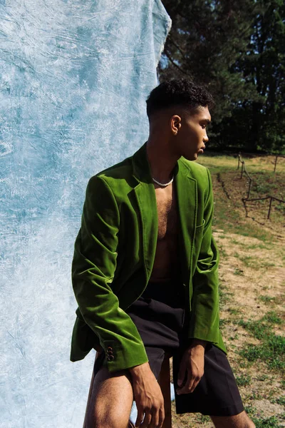 Young African American Man Green Velvet Blazer Black Shorts Sitting —  Fotos de Stock