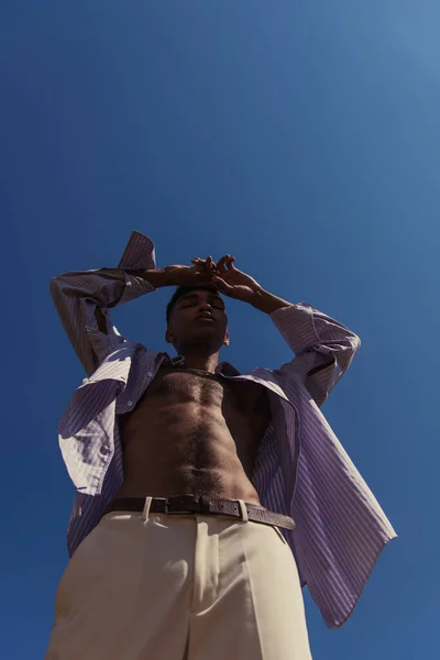 Low Angle View African American Man Shirt Posing Hands Head — 스톡 사진