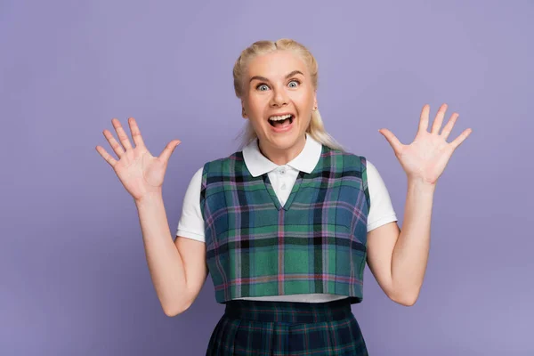 Excited Blonde Student Looking Camera Isolated Purple — стоковое фото