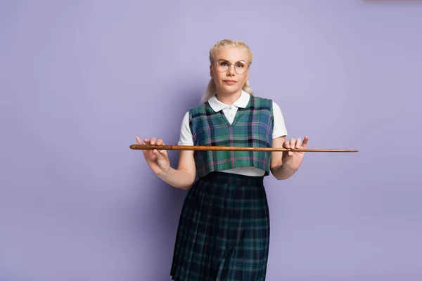 Student Uniform Holding Pointer Looking Camera Purple Background — Fotografia de Stock