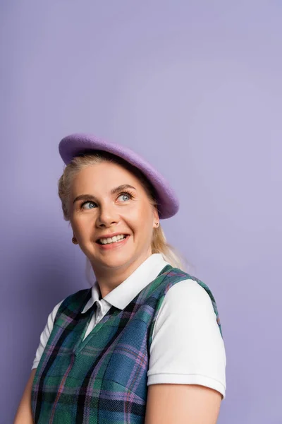 Smiling Student Checkered Vest Beret Looking Away Purple Background — Stok fotoğraf