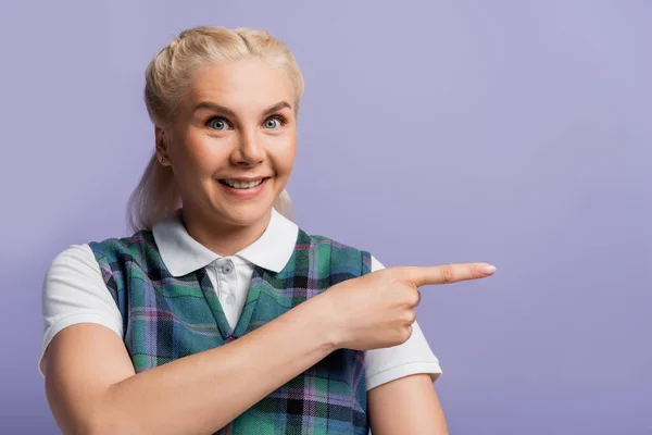 Cheerful Student Vest Shirt Pointing Finger Isolated Purple — стоковое фото